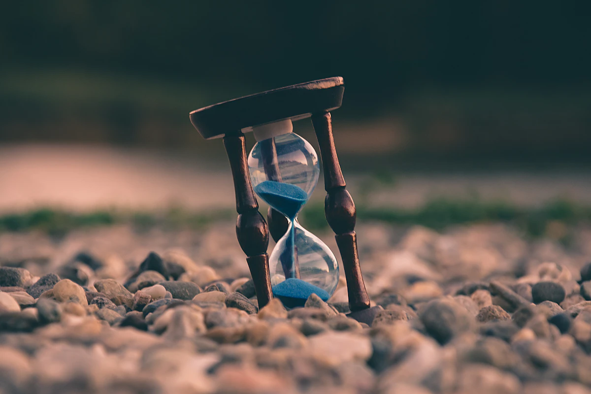 A wall clock on an office wall showing working hours